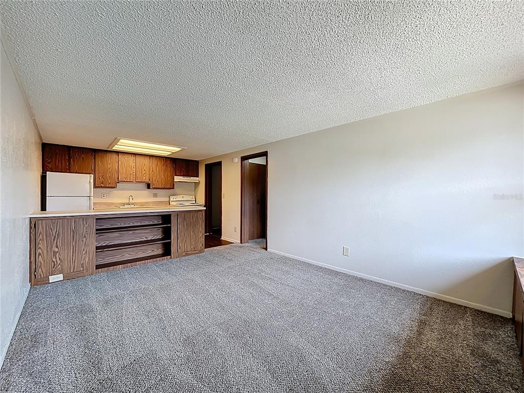 611 Mt Homer Road Eustis, FL 32726 - Photo 1 of 20 a view of a kitchen with refrigerator and a sink