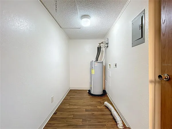 a view of a storage & utility room with wooden floor