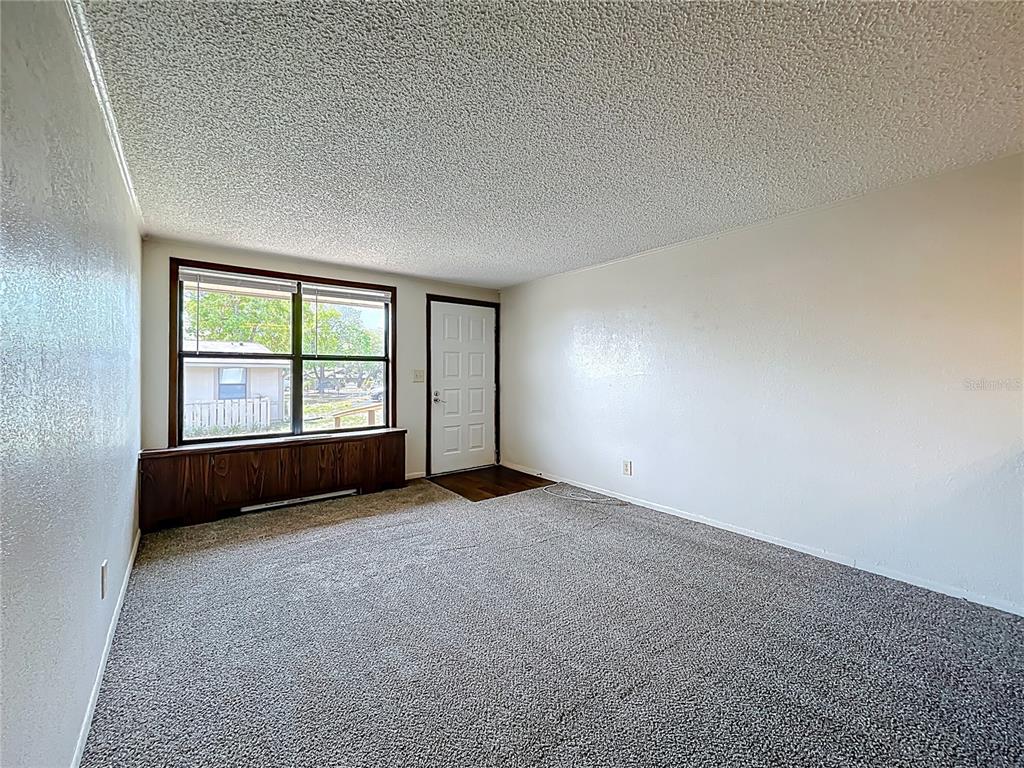 611 Mt Homer Road Eustis, FL 32726 - Photo 3 of 20 an empty room with windows