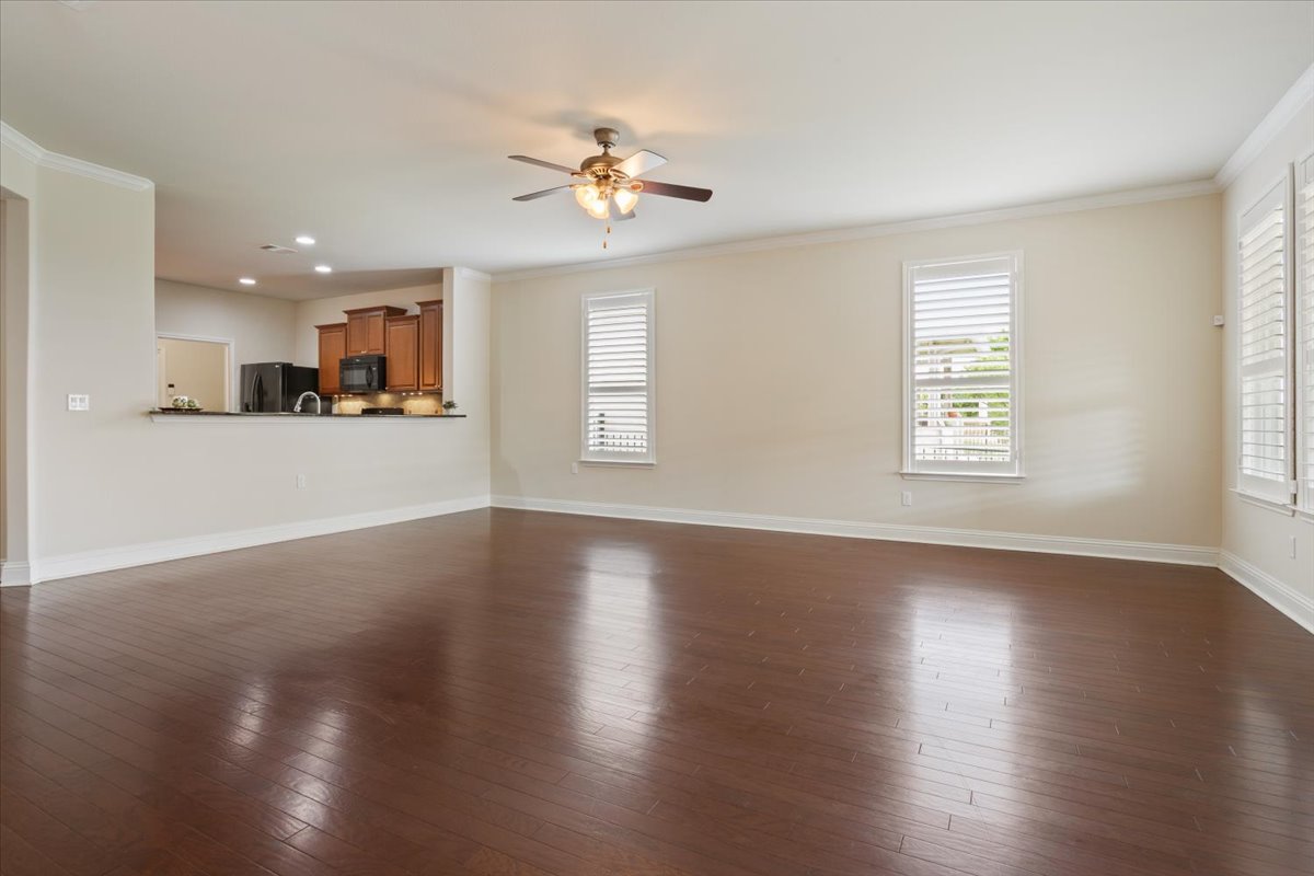 905 Mount Locke Court Georgetown, TX 78633 - Photo 14 of 36 a view of an empty room with wooden floor and a window