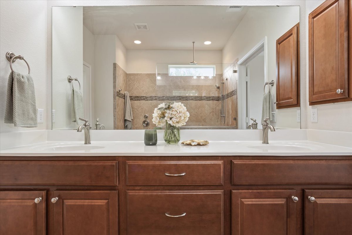 905 Mount Locke Court Georgetown, TX 78633 - Photo 21 of 36 a kitchen with a sink and a refrigerator
