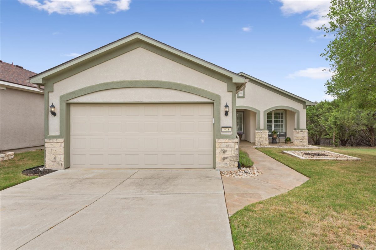 905 Mount Locke Court Georgetown, TX 78633 - Photo 3 of 36 a front view of a house with yard