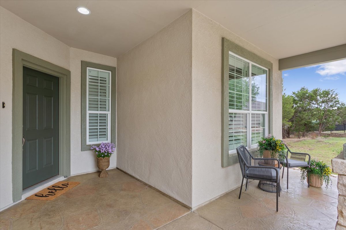 905 Mount Locke Court Georgetown, TX 78633 - Photo 5 of 36 a view of a porch with chairs and potted plants
