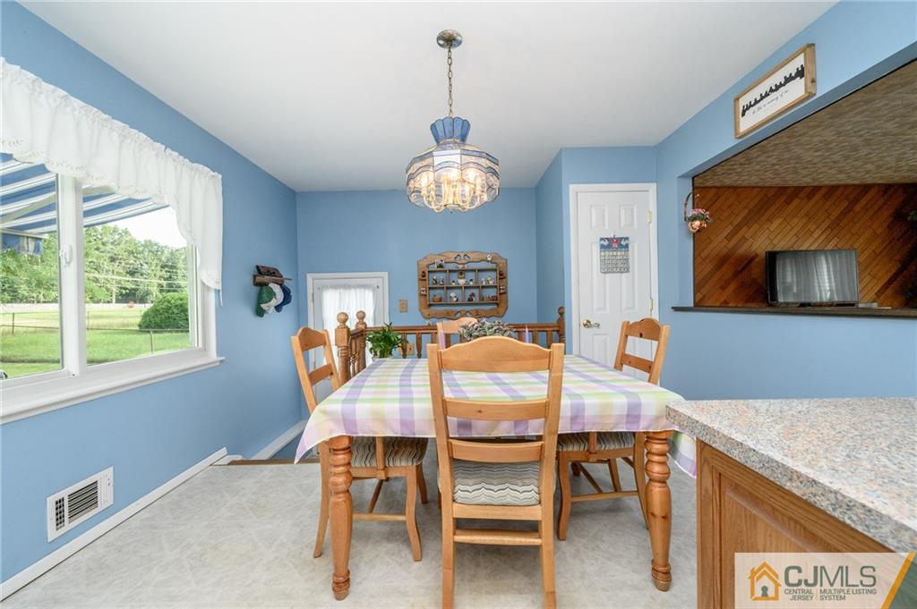 25 Drexel Drive Jackson, NJ 08527 - Photo 13 of 34 a view of a dining room with furniture window and outside view