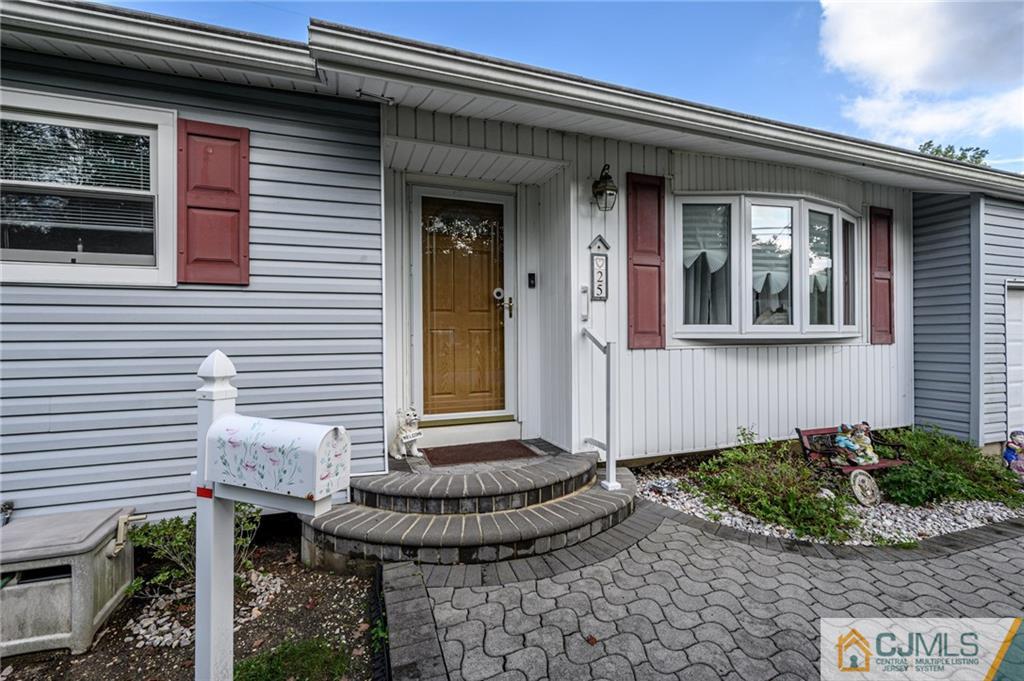 25 Drexel Drive Jackson, NJ 08527 - Photo 2 of 34 a front view of a house with porch
