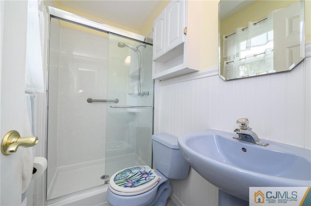 25 Drexel Drive Jackson, NJ 08527 - Photo 22 of 34 a bathroom with a sink a toilet and shower