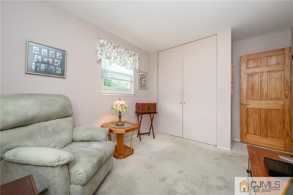 25 Drexel Drive Jackson, NJ 08527 - Photo 24 of 34 a living room with furniture and a window
