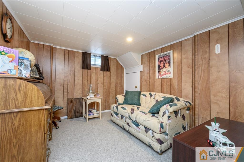 25 Drexel Drive Jackson, NJ 08527 - Photo 27 of 34 a living room with furniture a couch and a window