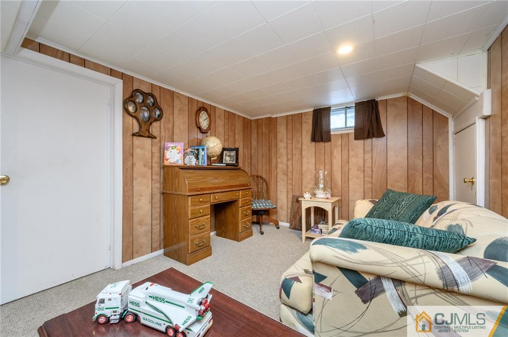 25 Drexel Drive Jackson, NJ 08527 - Photo 28 of 34 a living room with furniture and a table
