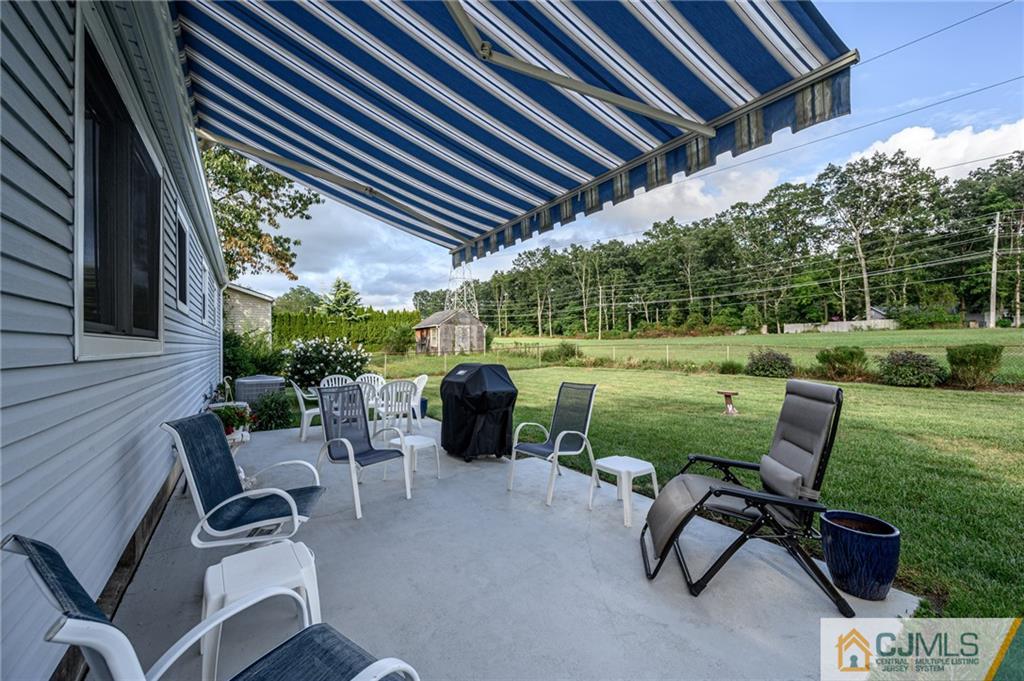 25 Drexel Drive Jackson, NJ 08527 - Photo 31 of 34 a view of a patio with chairs and a table