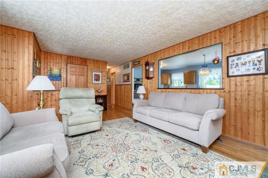 25 Drexel Drive Jackson, NJ 08527 - Photo 7 of 34 a living room with furniture and a large window