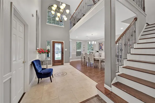 a view of a livingroom with furniture and stairs