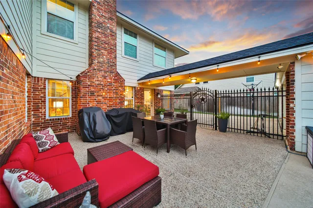 a view of a patio with couches chairs and a table and chairs