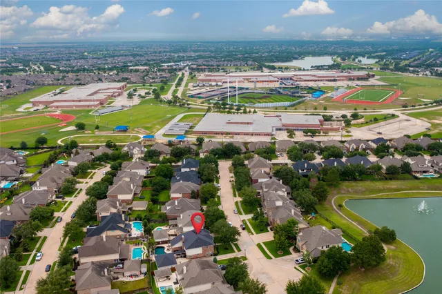 an aerial view of residential houses with outdoor space
