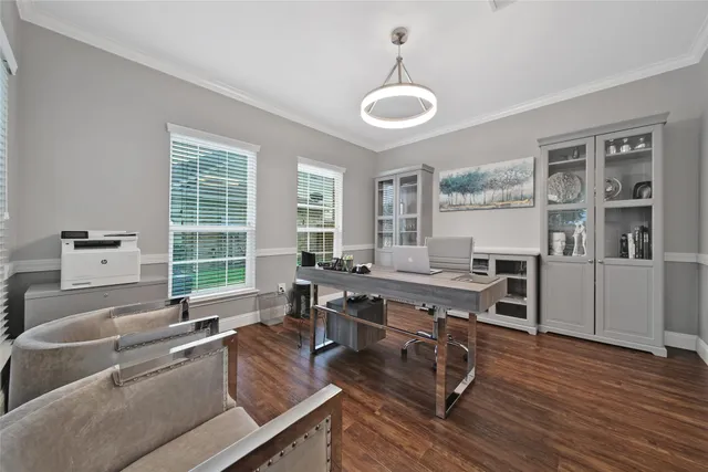 a living room with furniture flat screen tv and window