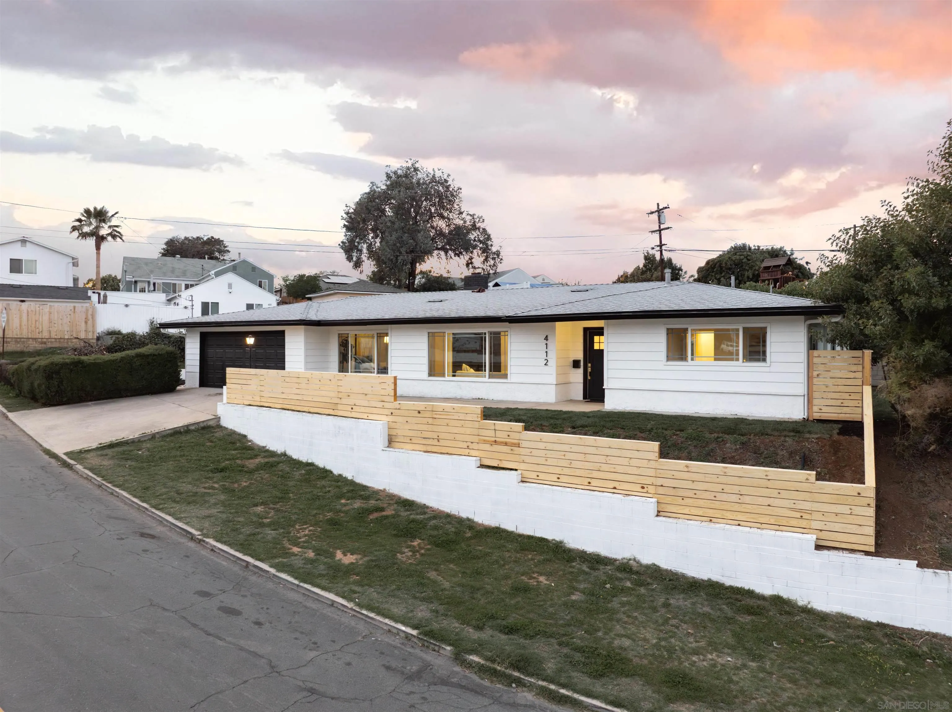 4112 Lois Street La Mesa, CA 91941 - Photo 1 of 39 a front view of a house with a yard