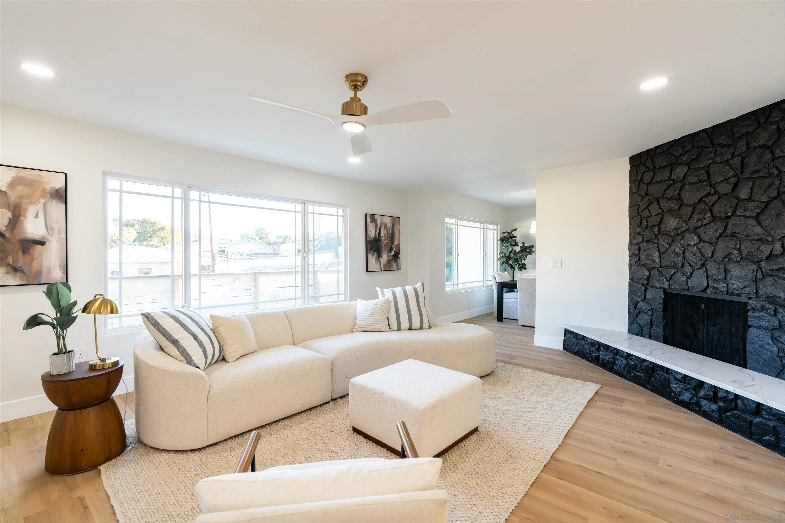4112 Lois Street La Mesa, CA 91941 - Photo 18 of 39 a living room with furniture and a fireplace