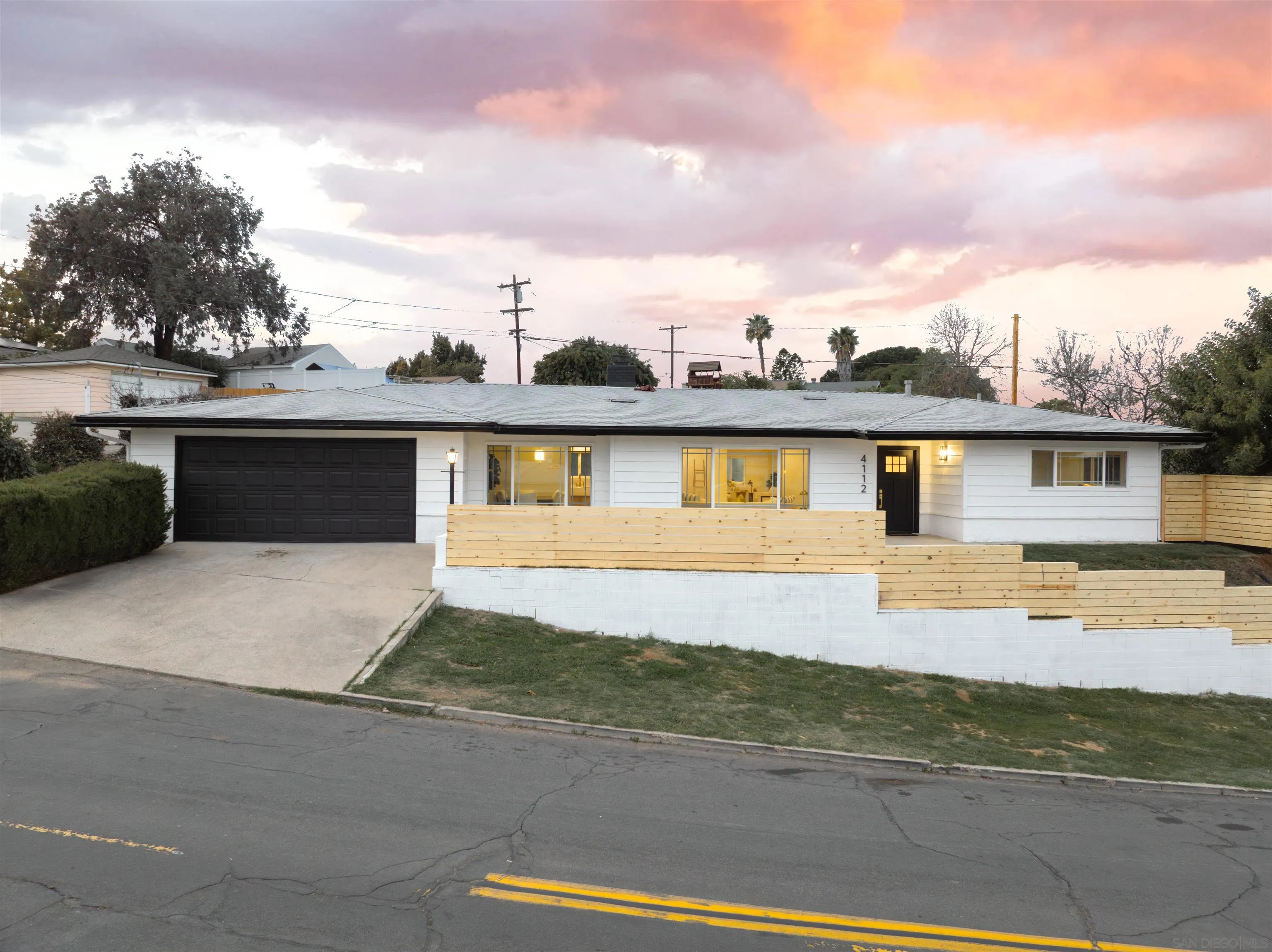 4112 Lois Street La Mesa, CA 91941 - Photo 2 of 39 a front view of a house with a yard
