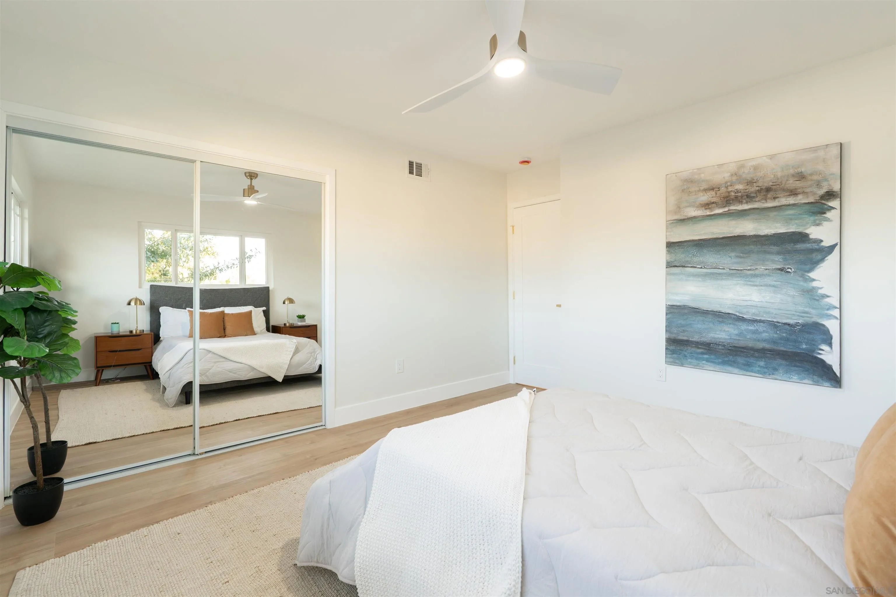 4112 Lois Street La Mesa, CA 91941 - Photo 26 of 39 a bedroom with a bed and a large window