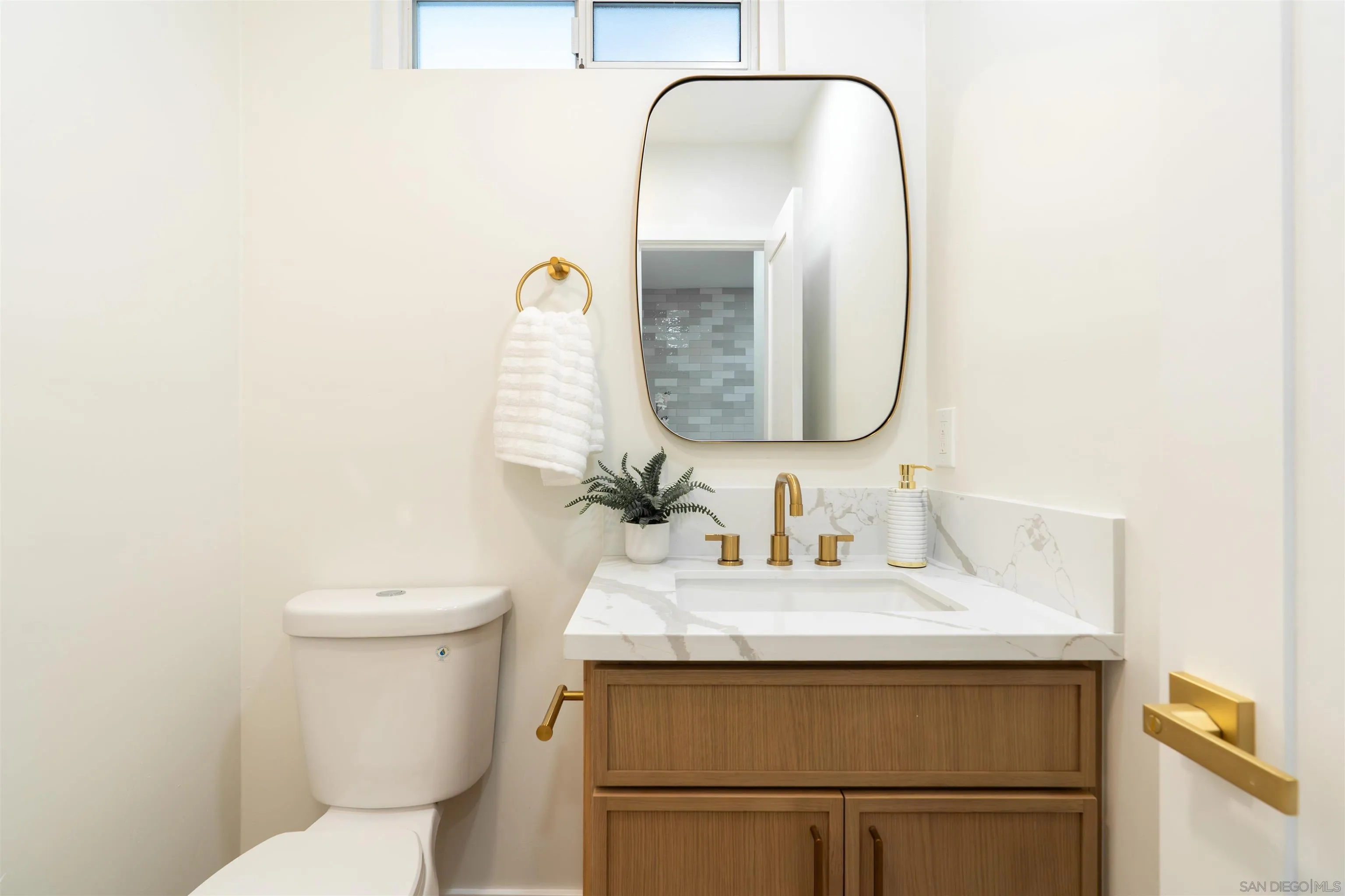 4112 Lois Street La Mesa, CA 91941 - Photo 30 of 39 a bathroom with a sink and a mirror