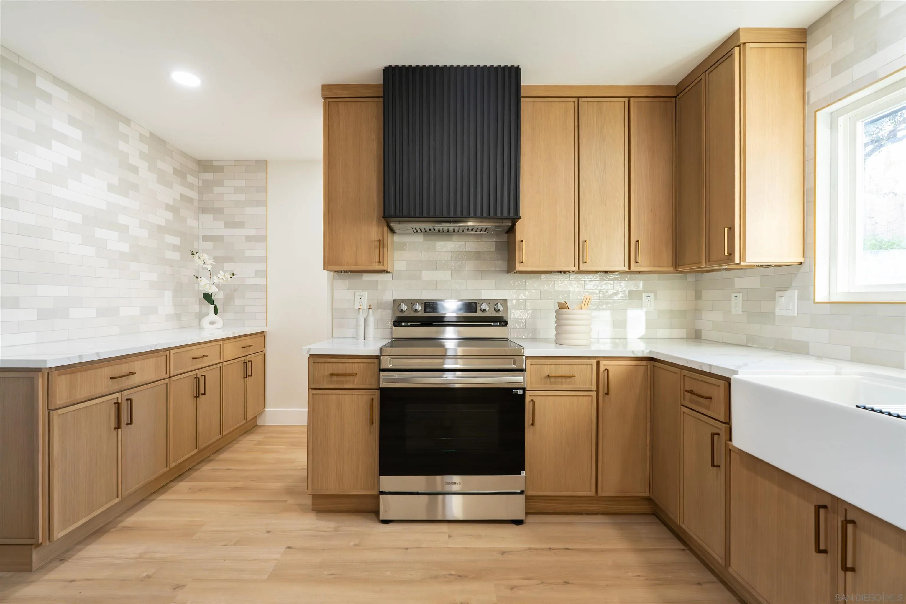 4112 Lois Street La Mesa, CA 91941 - Photo 8 of 39 a kitchen with stainless steel appliances granite countertop a stove and a sink