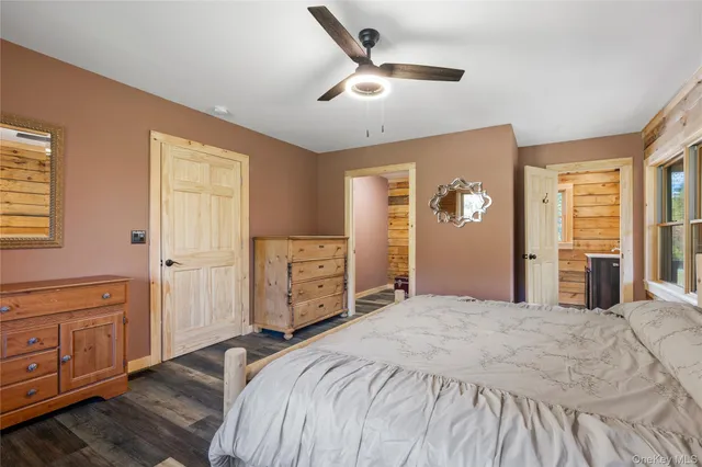 a bedroom with a bed and a shower