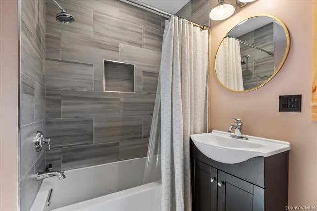 a front view of a house with garden and trees