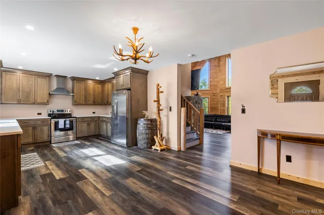 a kitchen with a sink stove and refrigerator
