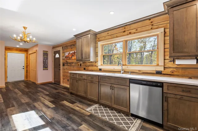 a view of a refrigerator in kitchen and living room