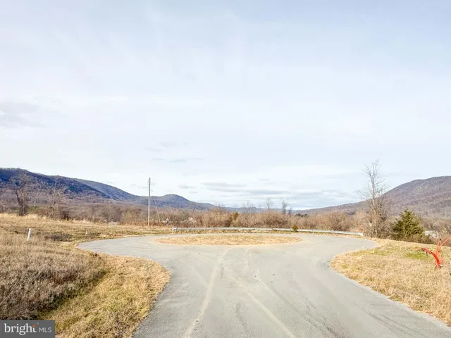 a view of mountain with lake view