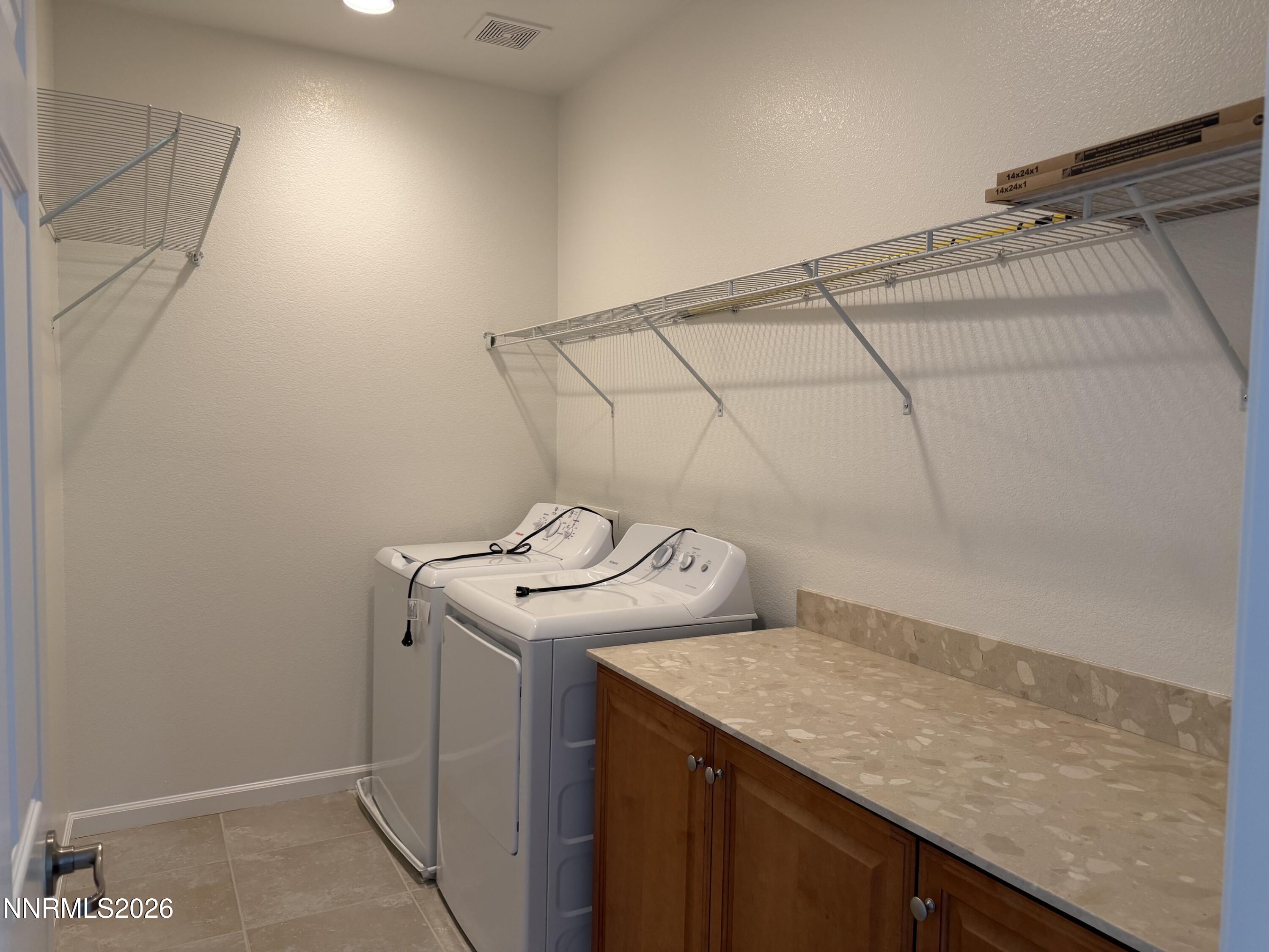 10890 Oakhaven Drive Reno, NV 89521 - Photo 16 of 28 a utility room with dryer and washer