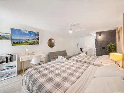a bedroom with a bed and dresser
