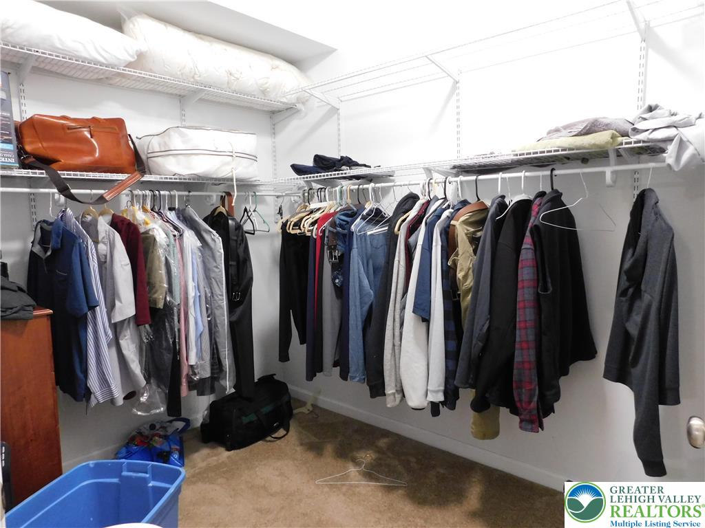 1047 Cetronia Road, Unit 3 Breinigsville, PA 18031 - Photo 12 of 19 a view of walk in closet with clothes and shoes