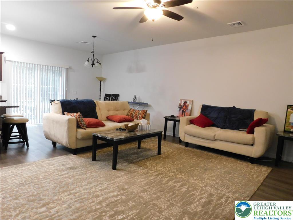 1047 Cetronia Road, Unit 3 Breinigsville, PA 18031 - Photo 4 of 19 a living room with furniture and a chandelier