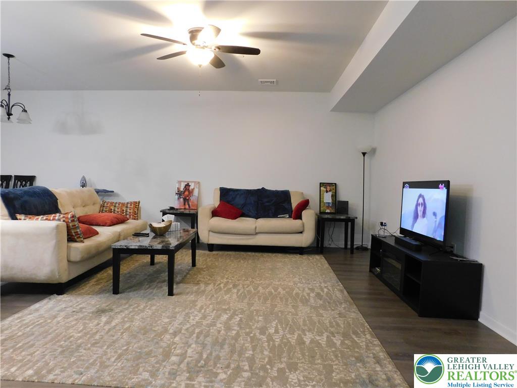 1047 Cetronia Road, Unit 3 Breinigsville, PA 18031 - Photo 5 of 19 a living room with furniture and a flat screen tv