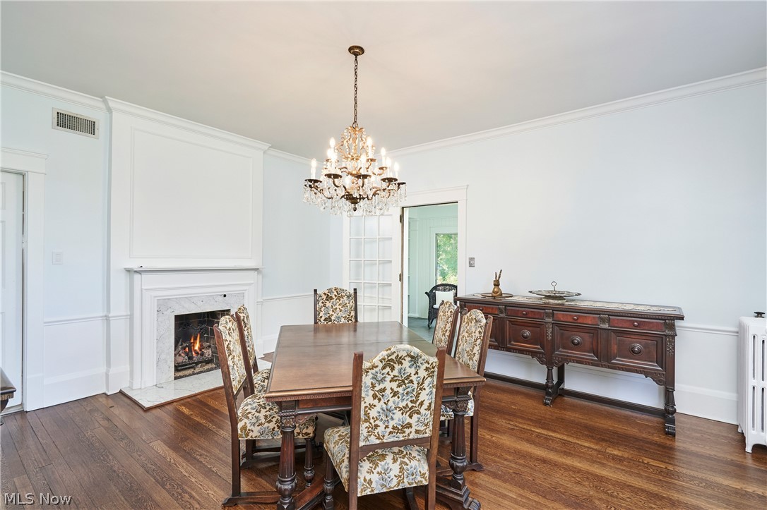 874 Merriman Road Akron, OH 44303 - Photo 19 of 50 Dining room with gas FP with marble surround and door leading to side porch