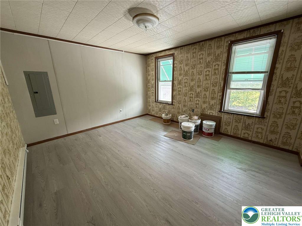 145-146 East Center Street, Unit 2 Nesquehoning, PA 18240 - Photo 3 of 8 a view of empty room with wooden floor and fan