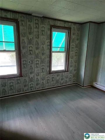 an empty room with windows
