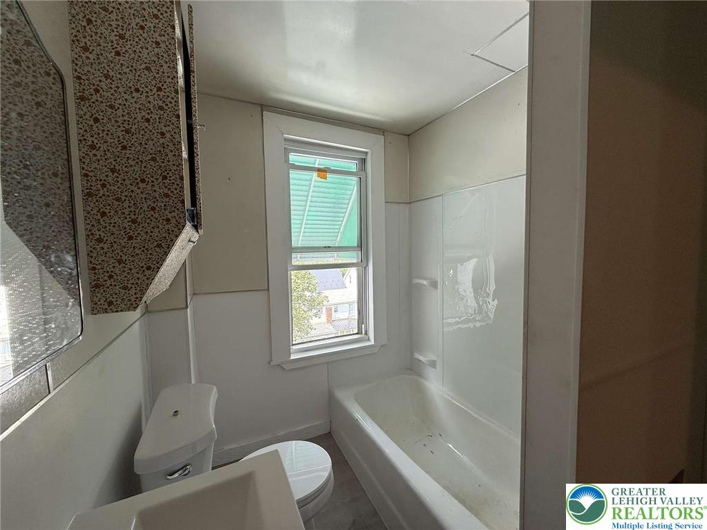 145-146 East Center Street, Unit 2 Nesquehoning, PA 18240 - Photo 8 of 8 a bathroom with a toilet a sink and bathtub