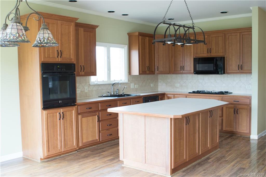 3112 Edwards Road Wingate, NC 28174 - Photo 8 of 21 a kitchen with a sink a counter top space and appliances
