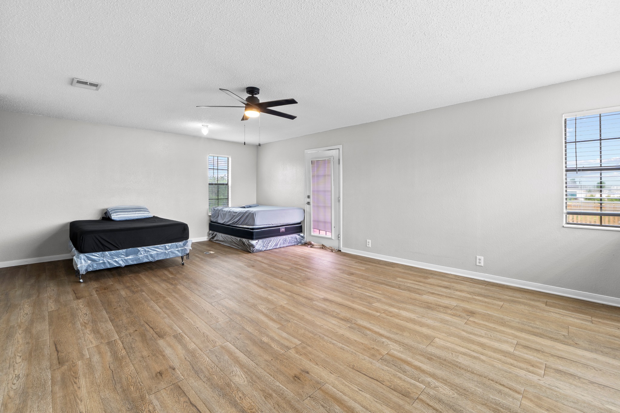205 Sedro Trail Georgetown, TX 78633 - Photo 18 of 32 Natural light illuminates wide plank flooring throughout this adaptable living space.