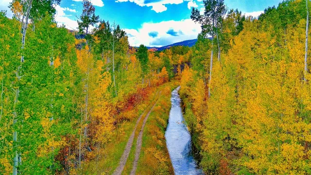 a view of residential houses with swimming pool