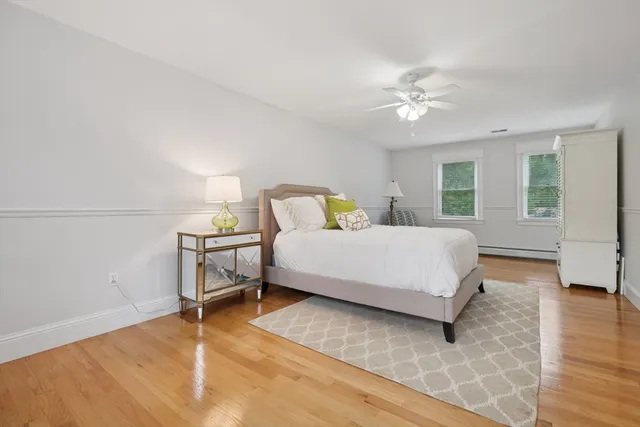 a bathroom with a granite countertop toilet sink and shower