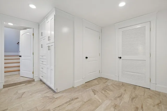 a living room with furniture and windows