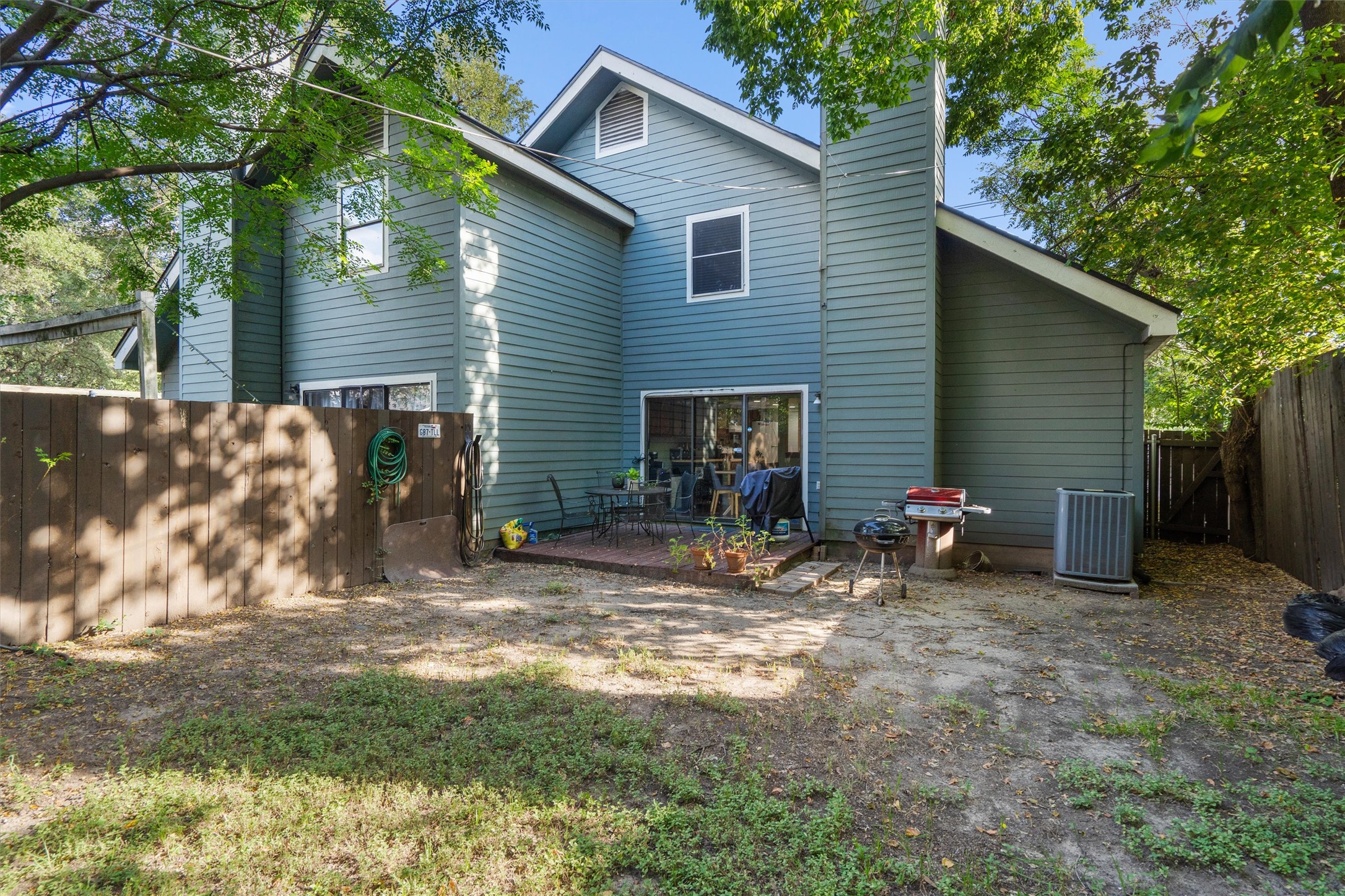 2414 Jones Road Austin, TX 78745 - Photo 25 of 26 A private, fenced backyard features a patio for outdoor enjoyment.