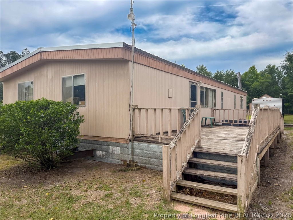 1308 Mac D Road Orrum, NC 28369 - Photo 24 of 32 a view of a house with wooden fence