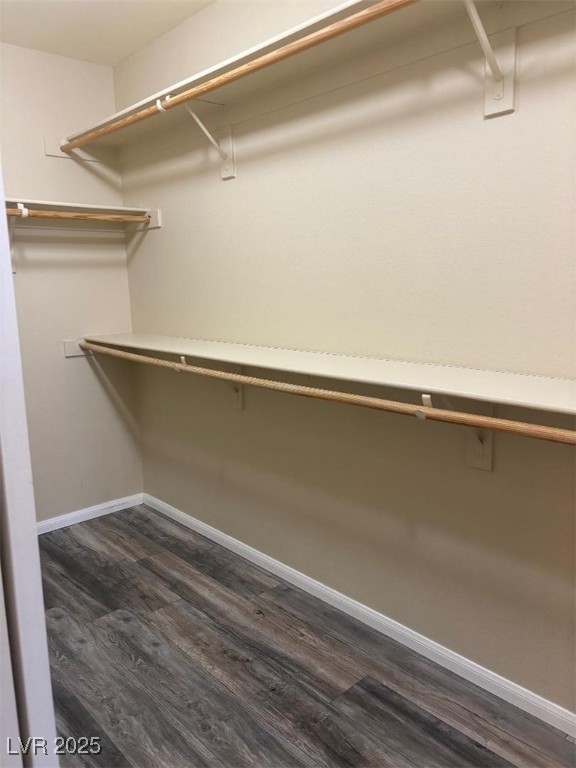 8690 West Diamond Sand Avenue Las Vegas, NV 89178 - Photo 11 of 25 Spacious closet with dark wood-type flooring