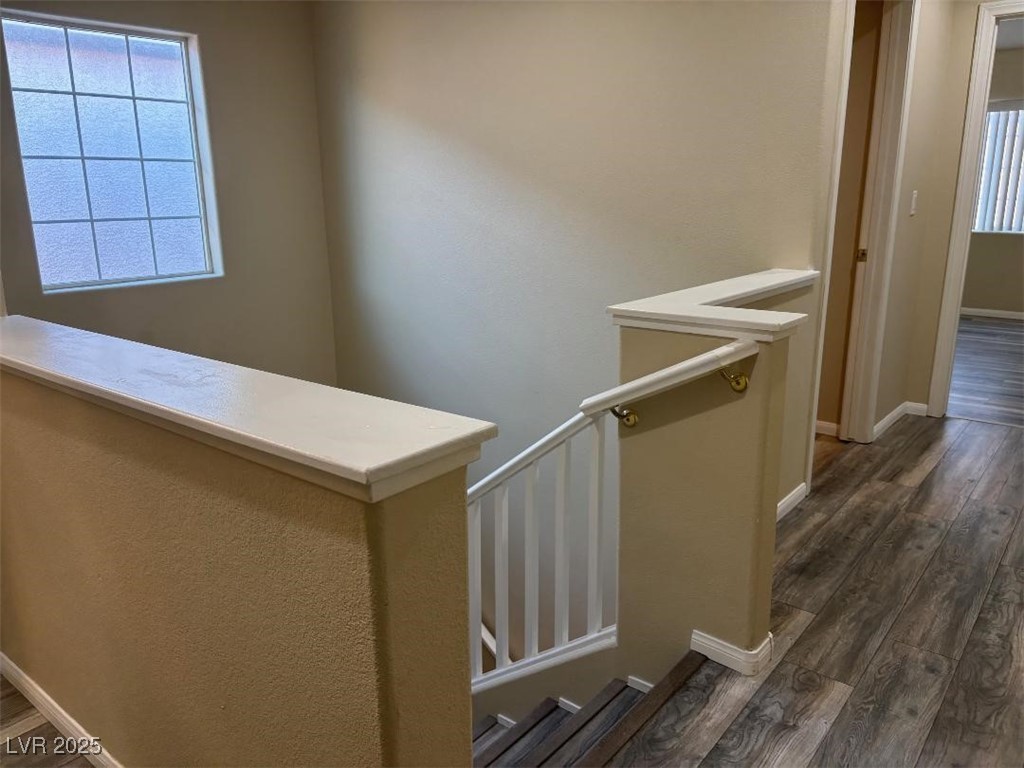 8690 West Diamond Sand Avenue Las Vegas, NV 89178 - Photo 19 of 25 Stairs with wood finished floors and baseboards