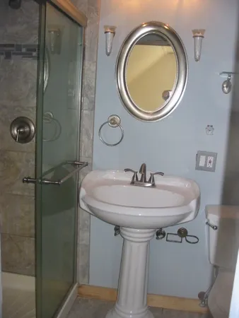 a bathroom with a sink and a mirror