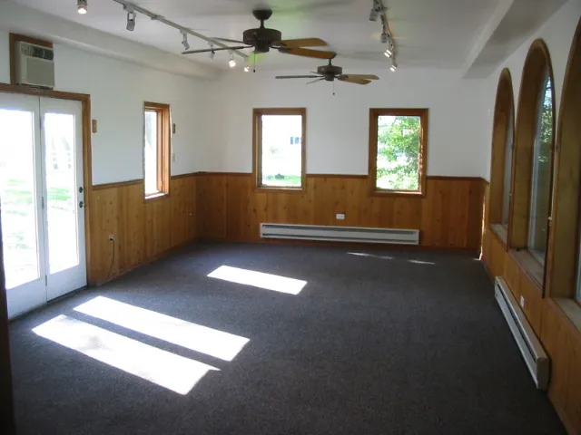 a view of livingroom with hardwood floor and a ceiling fan